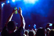 © Natalia - man holds a can of beer and claps his hands