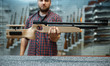 © Nomad_Soul - Male person shows pneumatic rifle in gun shop