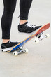 © herraez - Close up view of teen's feet on a skateboard ready to start a ride over the half pipe .