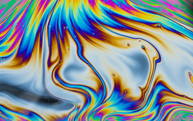 Wall Mural - psychedelic abstract background. photo macro shot with light interference on the surface of a soap b