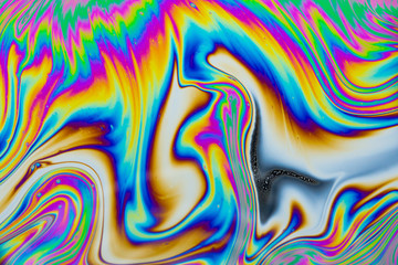 Wall Mural - psychedelic abstract background. photo macro shot with light interference on the surface of a soap b