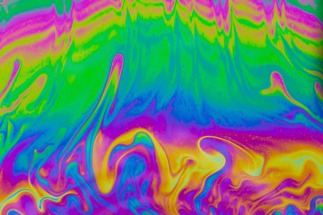 Psychedelic abstract background. Photo macro shot with light interference on the surface of a soap bubble