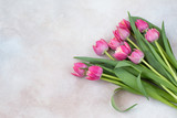 Fototapeta Tulipany - bouquet of pink tulips on the table 