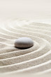 zen garden meditation stone background with stones and lines in sand for relaxation.