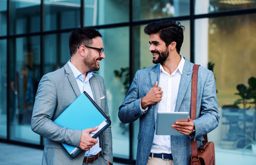 Wall Mural - Conversation about projects. Business people in front of the corporation. Business, lifestyle concept