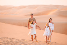 People Among Dunes In Desert In United Arab Emirates