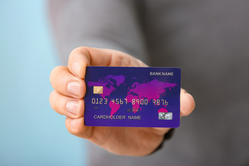 Man with credit card, closeup