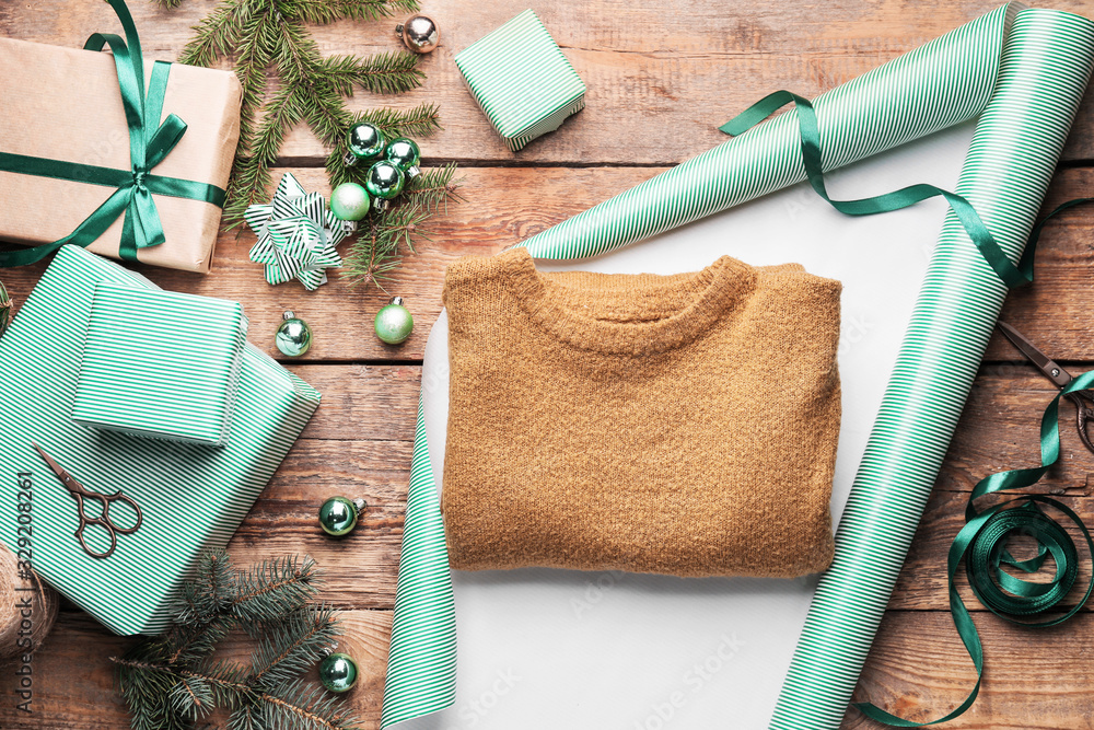 Making of beautiful Christmas gift on wooden background