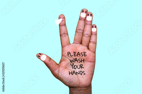 A hand with finger faces wearing face masks with one finger sneezing, please wash your hands text on hand, washing your hands with soap to stop infection spreading concept