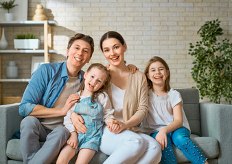 Wall Mural - Two children with mother and father.