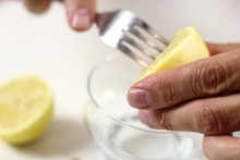 Juice Lemon Half With Assistance Of Fork. Making Lemon Mascarpone Pie Series.