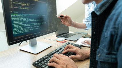 Wall Mural - team of programmers working together development website design and coding technologies in a softwar