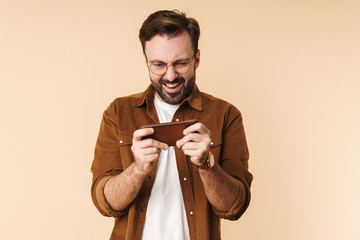 Poster - Portrait of a cheerful young arttractive bearded man