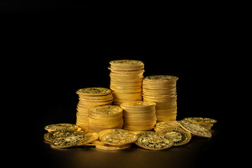 Stacks and a pile of old gold coins