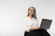 © Drobot Dean - Image of adult mature woman wearing office clothes using laptop computer