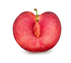 Red plum cut in half with seeds isolated on white background. Fresh plum clipping path.