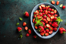 Fresh Strawberries In A Bowl On Wooden Table 
