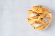 Round Bread Loaf or Boule isolated on the right side. Grey background. Copy space. Top view. Concept: healthy live. 