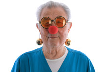 Red Nose Day, Portrait Of An Old Man With A Red Clown Nose