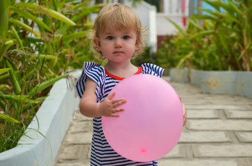 cute little girl outdoor in summertime spending happy leisure