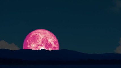 4k super pink moon rise back on silhouette island on the night sky