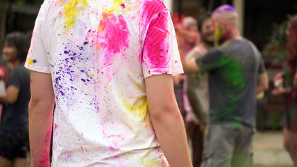 India colorful Holi festival abstract color powder on white shirt of girl back