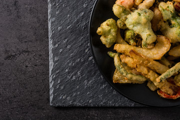 Wall Mural - Japanese vegetable tempura on black background.Top view.Copy space