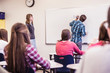 © MACO - School boy standing at the white board in classroom. Red Lodge, Montana, USA