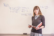 © MACO - School teacher standing in front of white board . Red Lodge, Montana, USA