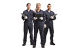 One female and two male workers in overall uniforms
