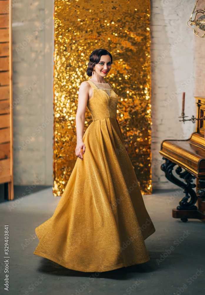Beautiful young woman finger wave hairstyle in long luxurious elegant gold  dress smiles bright makeup red lips fashion style 1920 Great Gatsby.  ackdrop brilliant screen pionino. Graduation party Prom Stock-foto | Adobe