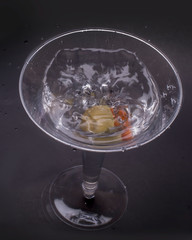 Dry martini served with an olive for a refreshing alcoholic drink for relaxation