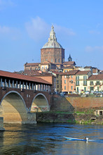 Pavia, Italy. February14,2018. The Ponte Coperto ("covered Bridge") Or The Ponte Vecchio ("Old Bridge") Is A Brick And Stone Arch Bridge Over The Ticino River In Pavia, Italy. Duomo Di Pavia Visible