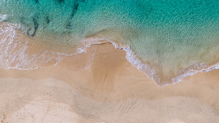  Top View on Coast of Atlantic Ocean, waves on beach aerial view, crystal clear water in Morro Jable Fuerteventura. 