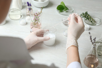 Wall Mural - Scientist developing cosmetic product in laboratory, closeup