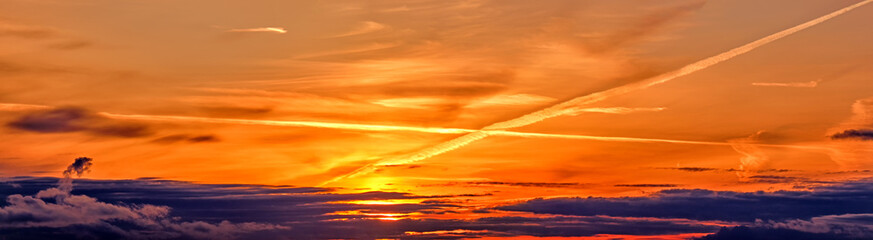 Wall Mural - scenic sunset sky landscape background natural color of evening cloudscape panorama with setting sun