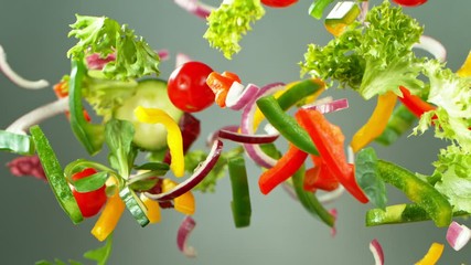 Wall Mural - Super Slow Motion Shot of Flying Fresh Vegetables. Shot with high speed cinematic camera, super slow motion at 1000 fps.