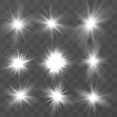 Wall Mural - set of white glowing light . sparkling magical dust particles. star burst with sparkles on a transpa