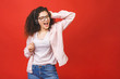 © denis_vermenko - Funny attractive pretty lovely stylish nice cheerful curly-haired brunette student girl in casual, listening to music, dancing, isolated on red background.