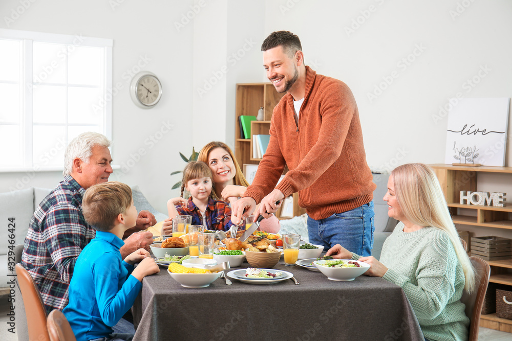 Family celebrating Thanksgiving Day at home