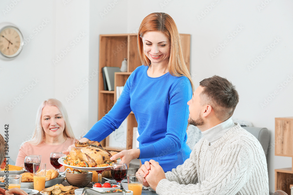 Family celebrating Thanksgiving Day at home