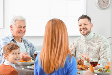 Wall Mural - Family celebrating Thanksgiving Day at home