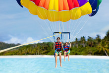 Kids Parasailing. Water Sport On Summer Vacation.