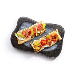 Canvas Print - Tasty bruschetta with fish and baked peppers