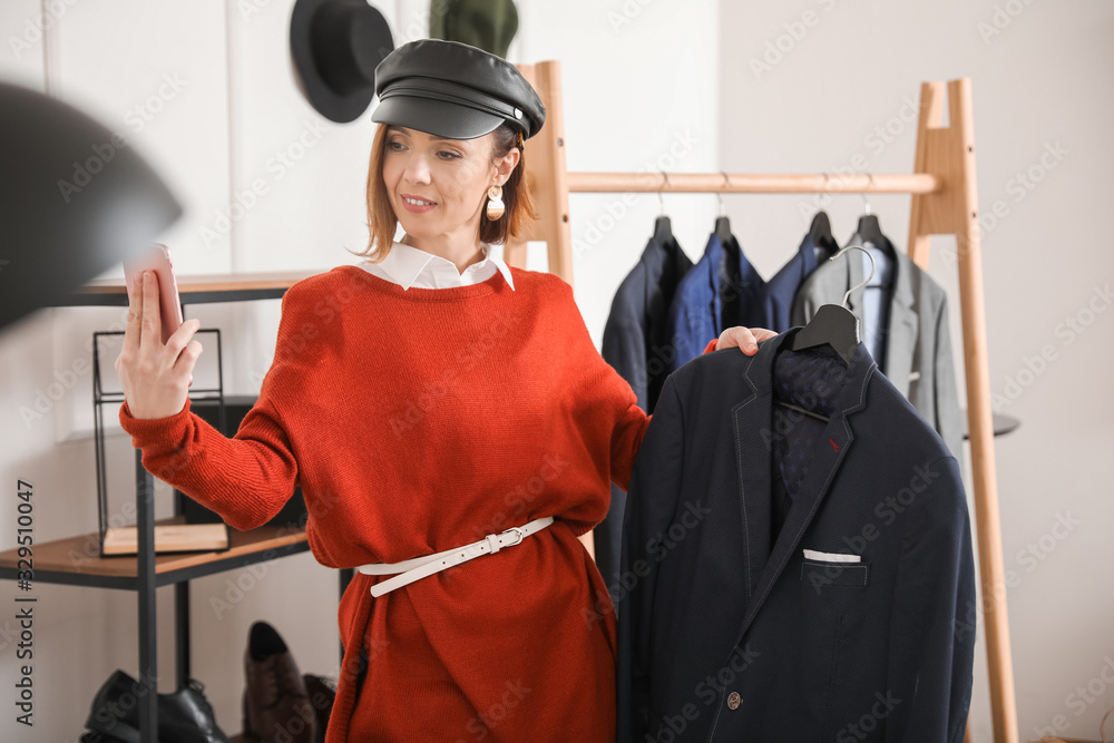 Female stylist recording video in her studio