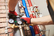 plumber installing water equipment - meter, filter and pressure reducer