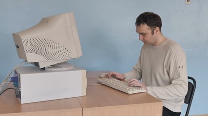 Person Typing At Old Retro Computer 