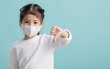© DN6 - Asian little child girl wearing respirator mask for stop coronavirus outbreak, New virus Covid-19 from Wuhan China concept, Empty space isolated on blue long banner