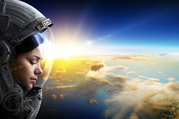 Wall Mural - female astronaut in space on planet orbit. . mixed media