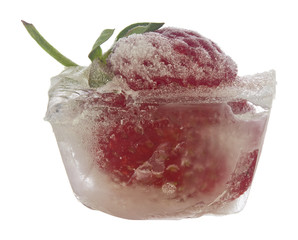 Canvas Print - Frozen strawberries in ice isolated on a white background close-up.